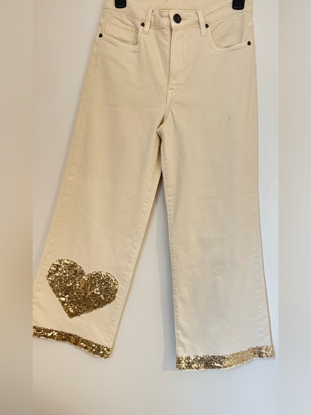 Kut from the Kloth wide leg jeans with sequence, heart, and trim on Cream Fabric